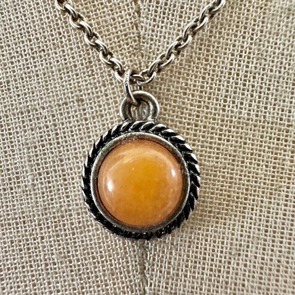 Silver tone and orange circle pendant necklace